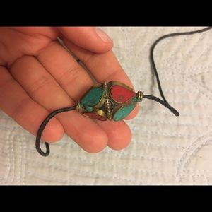 Turquoise & Red Charm on leather string
